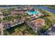 Aerial view of Gran Paradiso amenities including pool, playground, and clubhouse at 12460 Ghiberti Cir # 202, Venice, FL 34293