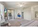 Main bedroom with patio access and a view into the living area at 12460 Ghiberti Cir # 202, Venice, FL 34293