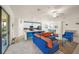 Spacious living room with sectional sofa and access to balcony, open to kitchen at 12460 Ghiberti Cir # 202, Venice, FL 34293