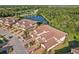 Townhome community near a lake with mature trees and landscaping at 12460 Ghiberti Cir # 202, Venice, FL 34293