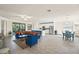 Open-concept living space with a sectional sofa, dining area, and kitchen at 12460 Ghiberti Cir # 202, Venice, FL 34293