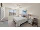 King bedroom with ceiling fan and window coverings at 12460 Ghiberti Cir # 202, Venice, FL 34293