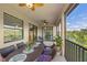 Relaxing screened balcony with table, chairs, and scenic view at 12460 Ghiberti Cir # 202, Venice, FL 34293