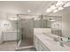 Spa-like bathroom with walk-in shower and double vanity at 12460 Ghiberti Cir # 202, Venice, FL 34293