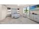 Spacious bedroom with large bed, dresser, and ensuite bathroom at 12460 Ghiberti Cir # 202, Venice, FL 34293
