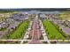 Aerial view of a community featuring a town center and lake at 12460 Ghiberti Cir # 202, Venice, FL 34293