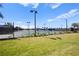Well-maintained tennis courts with ample surrounding green space at 12460 Ghiberti Cir # 202, Venice, FL 34293