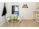 Cozy kitchen nook with white table and chairs, perfect for breakfast at 401 Curry St # 66, North Venice, FL 34275