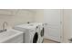 Laundry room equipped with a washer, dryer, sink and shelving at 12273 Stuart Dr, Venice, FL 34293