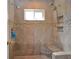 Walk-in shower with tiled surround at 217 Carriage House Ln # 217, Nokomis, FL 34275