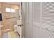Updated bathroom featuring a walk-in glass shower, grab bar, and white vanity at 217 Carriage House Ln # 217, Nokomis, FL 34275