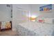 Comfortable bedroom with a beach-themed decor, shuttered window, and tile floors at 217 Carriage House Ln # 217, Nokomis, FL 34275