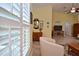 Inviting living room featuring neutral paint, natural light through shutters, and modern furnishings at 217 Carriage House Ln # 217, Nokomis, FL 34275