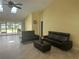 Spacious living room with vaulted ceilings, skylights, tile floors, and modern furniture at 217 Carriage House Ln # 217, Nokomis, FL 34275