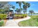 playground with play structures near pond at 25134 Spartina Dr, Venice, FL 34293