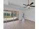 Bright and airy living room with sliding doors to a screened patio at 329 Savona Way, North Venice, FL 34275