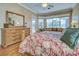 Spacious bedroom suite with large windows, wood floors, and neutral decor at 594 Sawgrass Bridge Rd, Venice, FL 34292