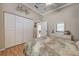 Bedroom with a queen-sized bed, closet, and a dresser, complemented by wood floors at 594 Sawgrass Bridge Rd, Venice, FL 34292