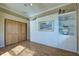 Spacious bedroom featuring built-in cabinetry, a murphy bed, and wood floors at 594 Sawgrass Bridge Rd, Venice, FL 34292