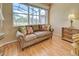 Relaxing sitting area in bedroom with large window overlooking outdoor views at 594 Sawgrass Bridge Rd, Venice, FL 34292