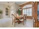 Formal dining room with elegant chandelier, decorative window, and seating for six at 594 Sawgrass Bridge Rd, Venice, FL 34292