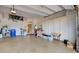 Well-lit two-car garage providing ample storage space with epoxy flooring at 594 Sawgrass Bridge Rd, Venice, FL 34292