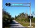 Scenic view of The Legacy Trail, a paved path through lush greenery, ideal for walking, biking, and enjoying nature at 594 Sawgrass Bridge Rd, Venice, FL 34292