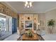 Well-lit living room featuring a decorative wall unit, neutral decor, and pool views at 594 Sawgrass Bridge Rd, Venice, FL 34292