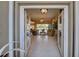 Bright and airy living room with tile flooring, neutral decor, and pool views at 594 Sawgrass Bridge Rd, Venice, FL 34292