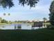 Scenic view of the pond from a relaxing bench at 594 Sawgrass Bridge Rd, Venice, FL 34292