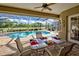 Relaxing screened-in lanai with a private swimming pool and spa, perfect for outdoor living at 594 Sawgrass Bridge Rd, Venice, FL 34292