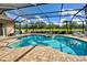 Enjoy the Florida sunshine in this private screened-in pool and spa, surrounded by tropical foliage at 594 Sawgrass Bridge Rd, Venice, FL 34292