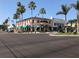 Local shopping center with several palm trees at 594 Sawgrass Bridge Rd, Venice, FL 34292
