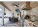 Luxury outdoor kitchen featuring stainless steel appliances and a stone facade at 5280 E Sunnydale Cir, Sarasota, FL 34233