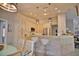 Updated kitchen features white cabinets, a large island, and stainless steel appliances at 5280 E Sunnydale Cir, Sarasota, FL 34233