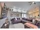 Spacious living room boasts a comfortable sectional sofa and a large flat-screen TV at 5280 E Sunnydale Cir, Sarasota, FL 34233