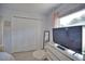 Bright bedroom with large closet and a TV at 5280 E Sunnydale Cir, Sarasota, FL 34233