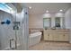 Spa-like bathroom with soaking tub and double vanity at 5280 E Sunnydale Cir, Sarasota, FL 34233