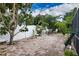 Spacious backyard patio with brick pavers and lush landscaping at 5280 E Sunnydale Cir, Sarasota, FL 34233