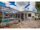 Enjoy this beautiful pool and patio with outdoor kitchen and screened enclosure at 5280 E Sunnydale Cir, Sarasota, FL 34233