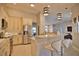 Modern kitchen boasts stainless steel appliances and light-colored cabinetry at 5280 E Sunnydale Cir, Sarasota, FL 34233