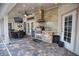 Outdoor kitchen with stainless steel appliances and stone facade at 5280 E Sunnydale Cir, Sarasota, FL 34233