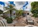 Inviting pool and patio with comfortable seating and lush landscaping at 5280 E Sunnydale Cir, Sarasota, FL 34233