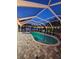 Stunning pool area at night with string lights and a relaxing ambiance at 5280 E Sunnydale Cir, Sarasota, FL 34233
