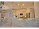 Modern kitchen with white cabinets, stainless steel appliances, and a breakfast bar at 5280 E Sunnydale Cir, Sarasota, FL 34233