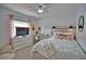 Cozy bedroom with a comfortable bed and plenty of natural light at 5280 E Sunnydale Cir, Sarasota, FL 34233