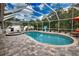 Relaxing pool area with covered patio, spa, and outdoor seating at 5280 E Sunnydale Cir, Sarasota, FL 34233