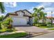 Inviting home with a two-car garage and nicely manicured lawn at 253 Calmar Way, Nokomis, FL 34275