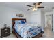 Guest bedroom with queen bed, ceiling fan, and ample closet space at 19304 Bluff Dr, Venice, FL 34292