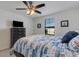 Bedroom with queen bed, dresser, and large window at 19304 Bluff Dr, Venice, FL 34292